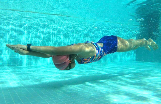 Freestyle out-sweep movement with palm facing outward and high wrist position                                                                        
