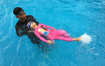 Backstroke flutter kick technique close to water surface                                                                                                            